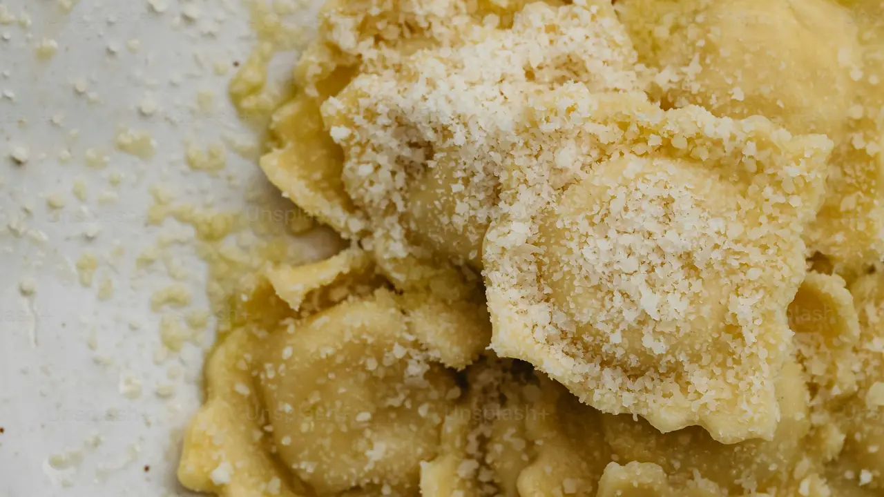 overhead view of corned beef sliced and on a platter with cabbage, potatoes, and carrots